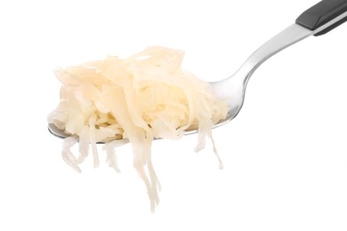 Photo of Spoon of tasty fermented cabbage on white background