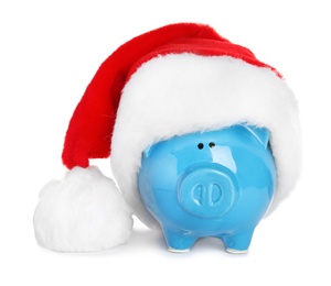 Cute piggy bank with Santa hat on white background