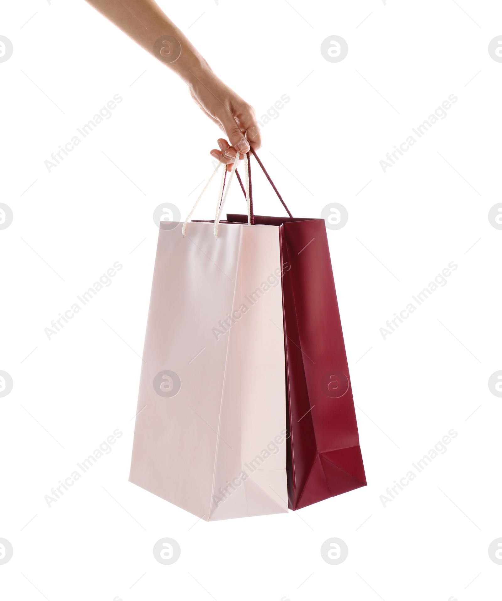 Photo of Woman with paper shopping bags on white background, closeup