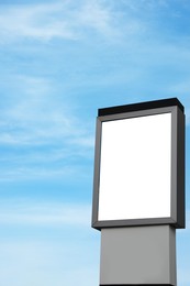 Image of Empty signboard against blue sky. Mock-up for design