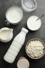 Photo of Many different lactose free dairy products on grey textured table, flat lay