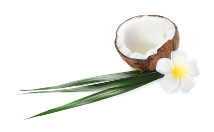 Photo of Ripe coconut with natural organic oil, flower and leaves isolated on white