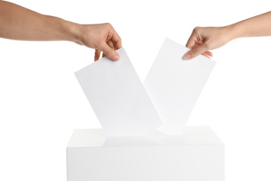 Photo of People putting their votes into ballot box on white background, closeup