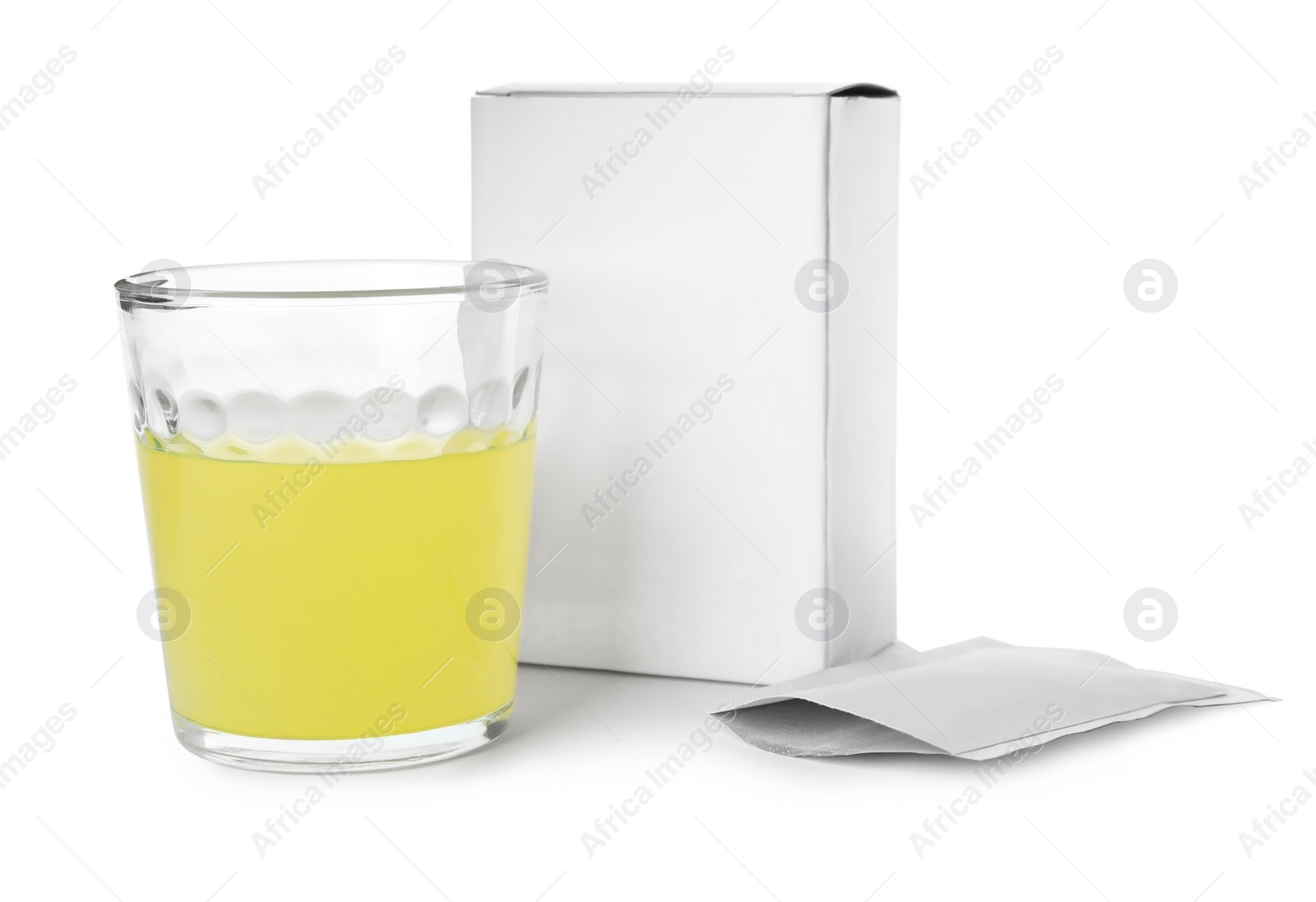 Photo of Box, sachet and glass of dissolved medicine on white background