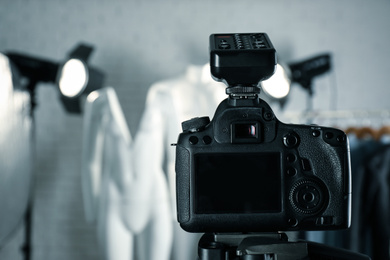 Taking pictures of ghost mannequins in professional studio, focus on camera. Fashion photography