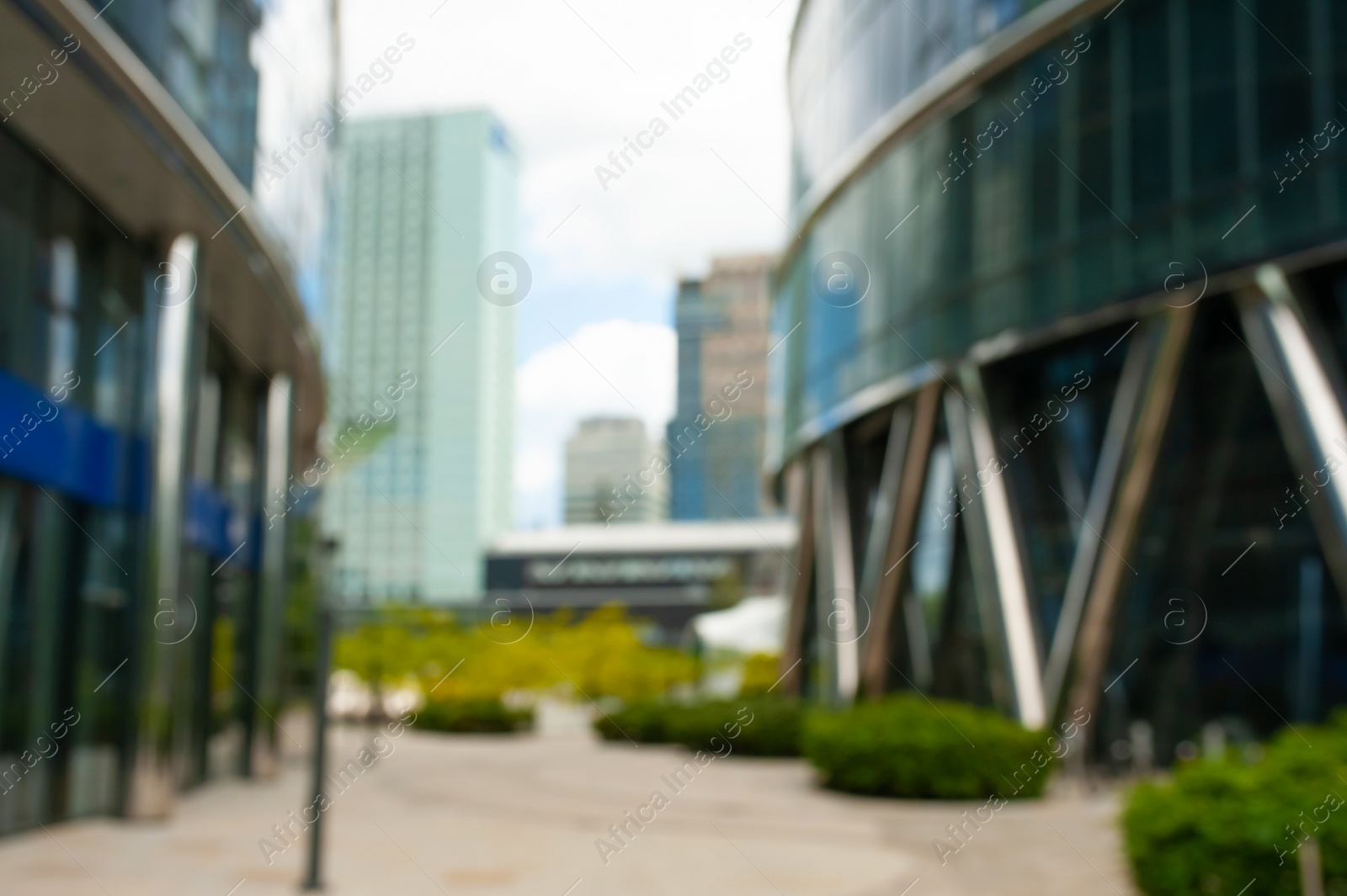 Photo of Beautiful buildings with many windows on cloudy day in city, blurred view