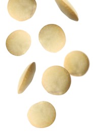 Many lentils falling on white background. Vegan diet 