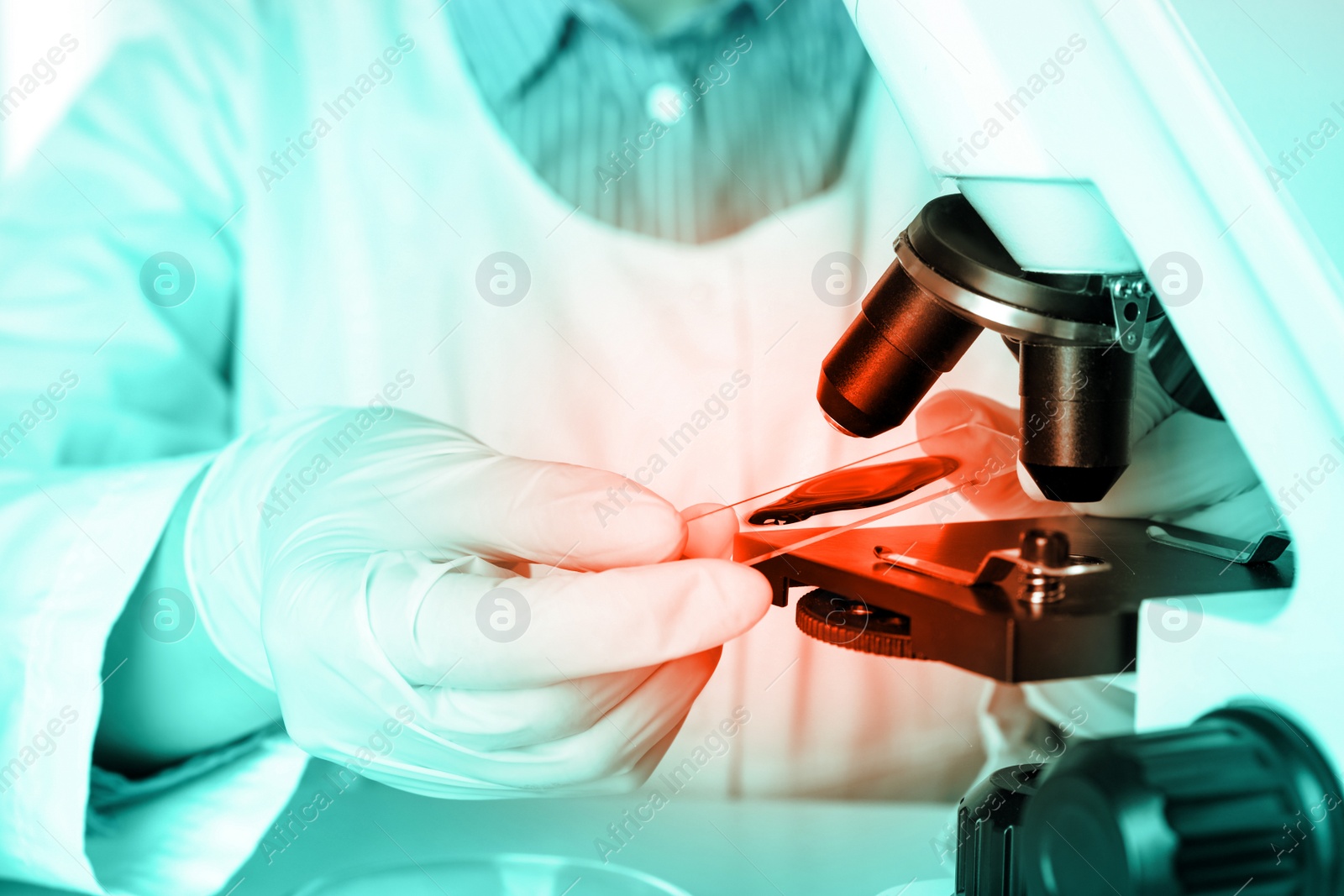 Image of Scientist examining blood sample with microscope, closeup. Laboratory analysis