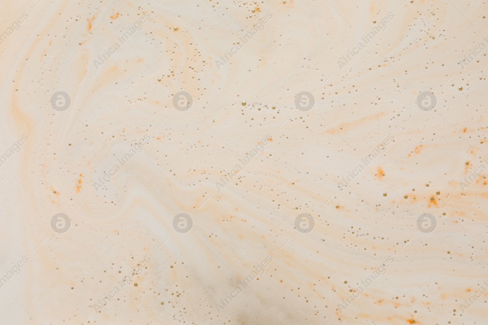 Photo of Foam after dissolving bath bomb in water, closeup