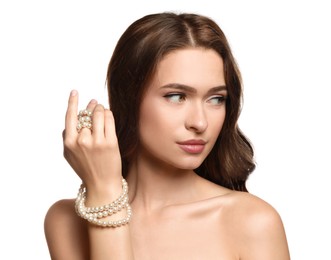 Photo of Young woman with elegant pearl necklace on white background