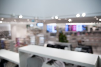 Photo of Blurred view of clothing store, bokeh effect