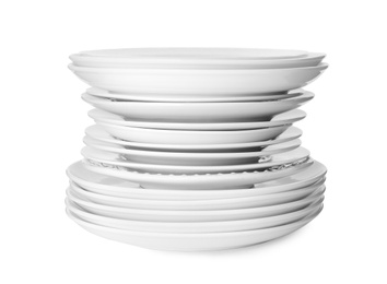 Photo of Stack of clean plates isolated on white