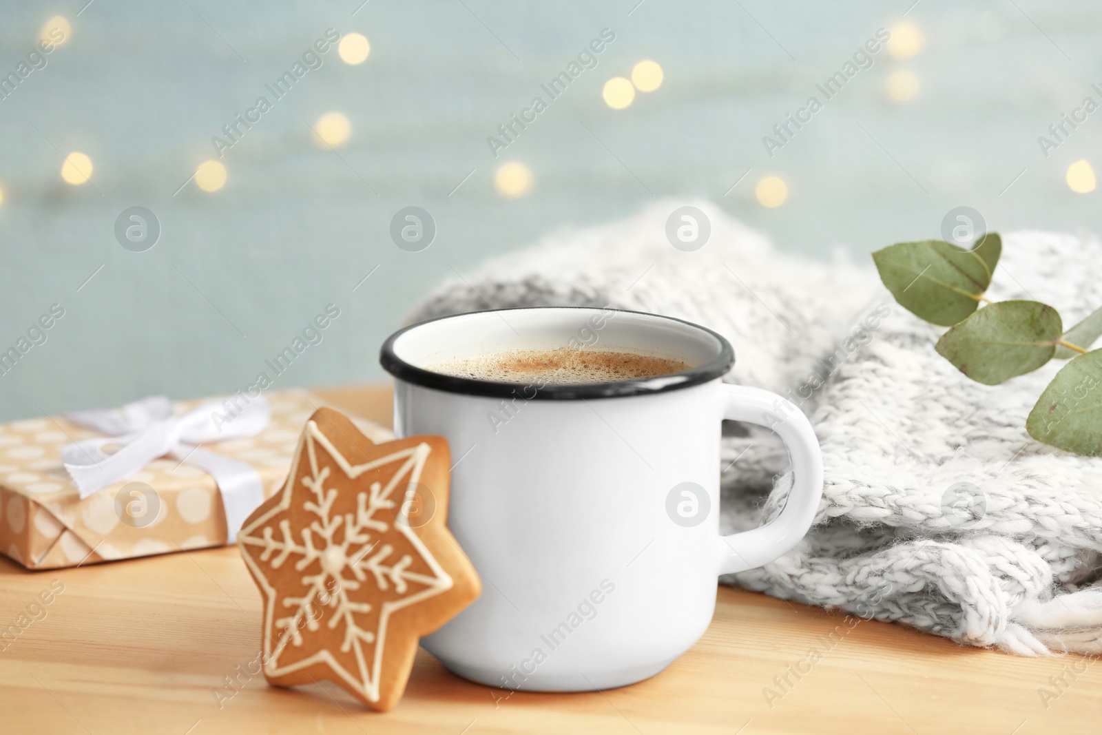 Photo of Composition with cup of hot winter drink and Christmas cookie on table. Cozy season