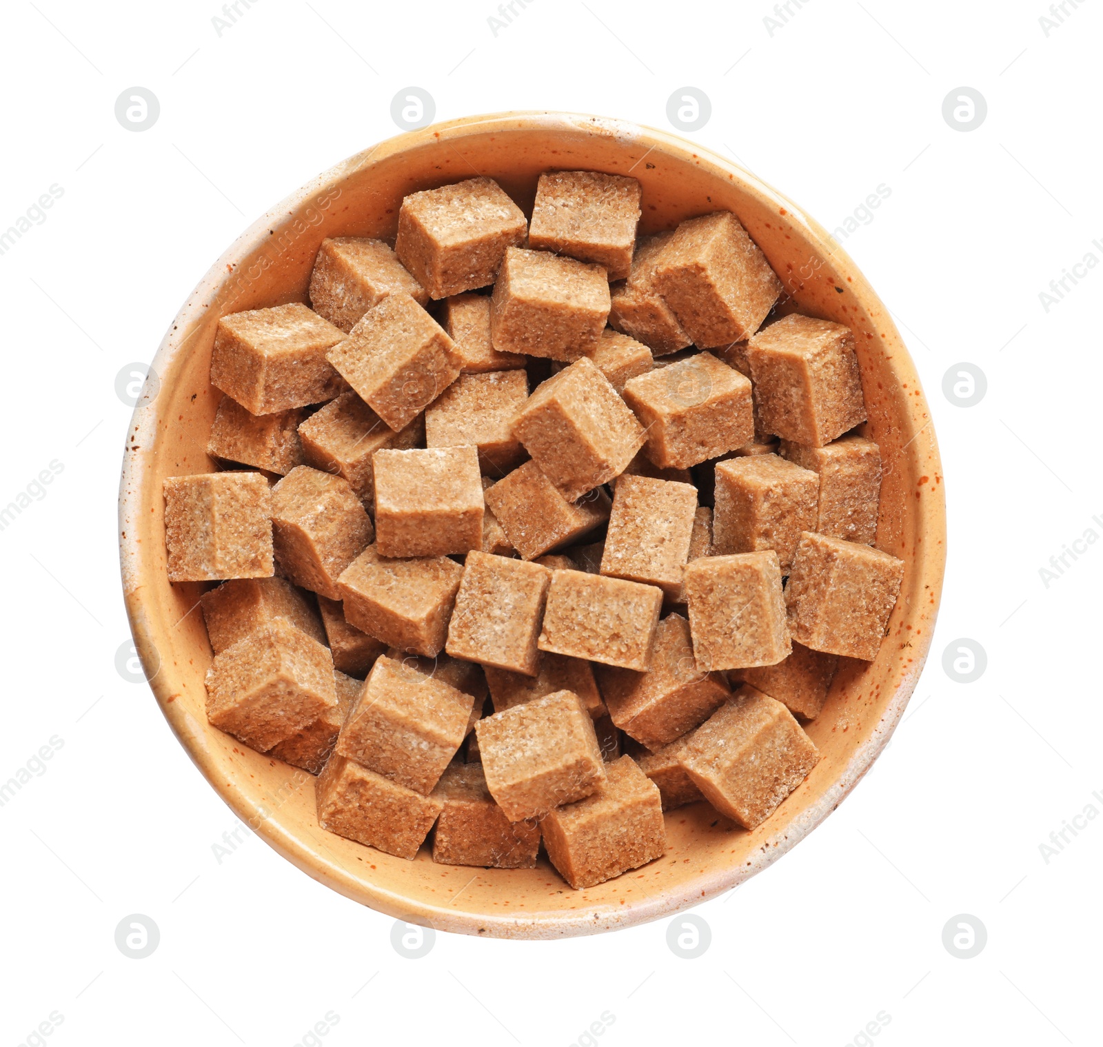 Photo of Bowl with cubes of brown sugar on white background