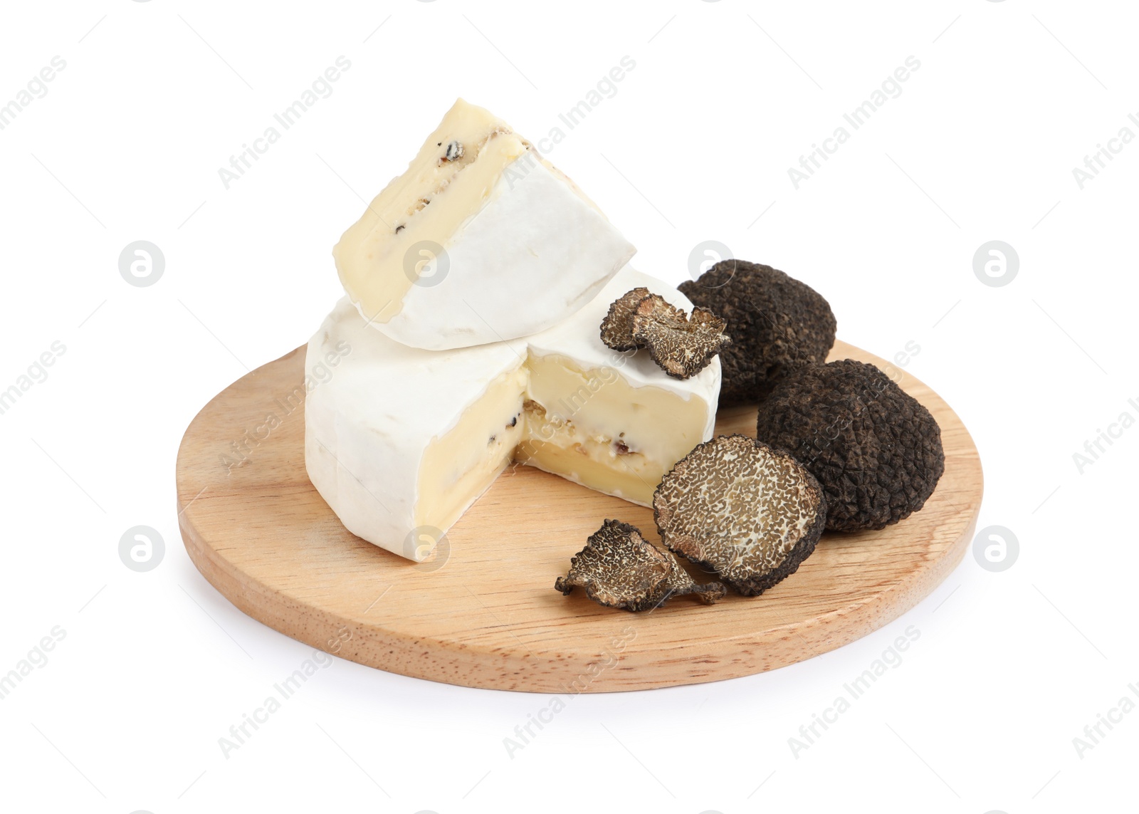 Photo of Wooden board with delicious cheese and fresh black truffles isolated on white