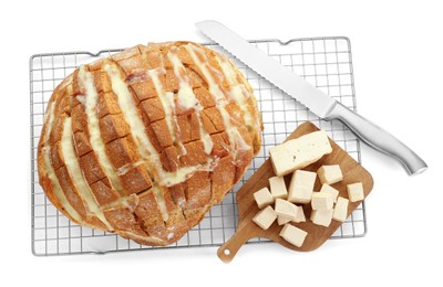 Photo of Freshly baked bread with tofu cheese and knife isolated on white, top view