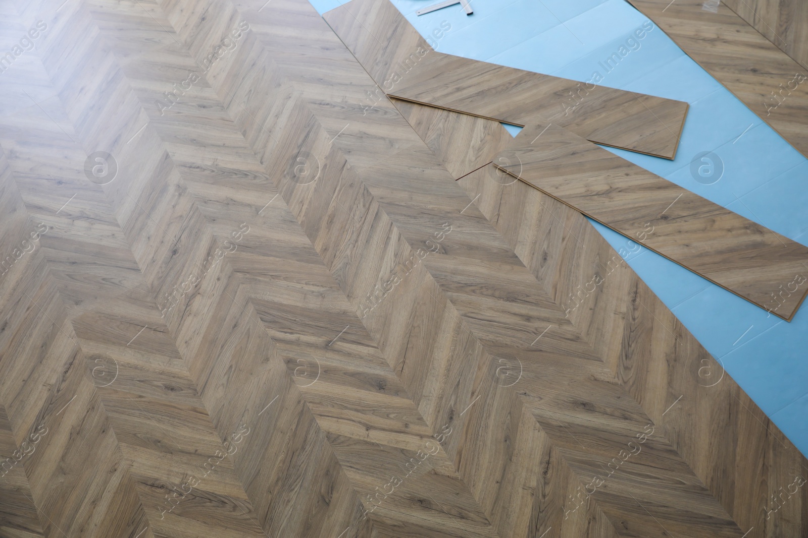 Photo of Installation of laminated wooden floor at home