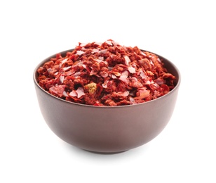 Photo of Bowl with chili pepper flakes on white background