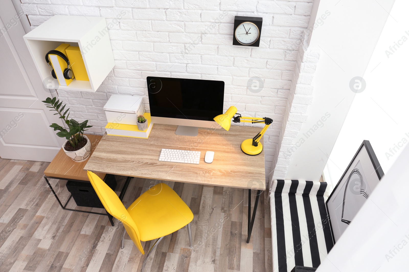 Photo of Comfortable workplace with computer on desk in home office