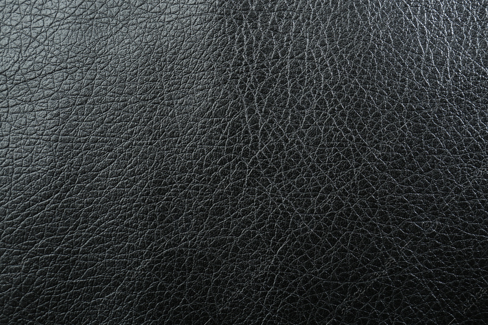 Photo of Texture of black leather as background, top view
