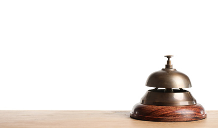 Hotel service bell on wooden table against white background