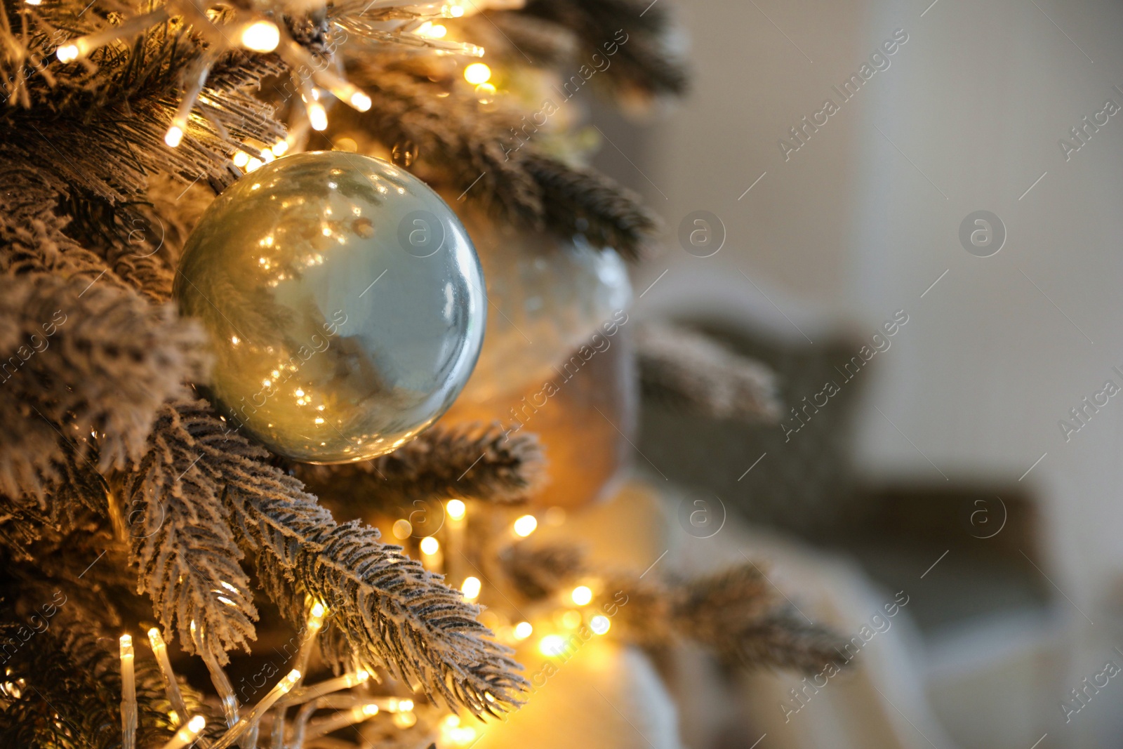 Photo of Closeup view of beautiful decorated Christmas tree indoors