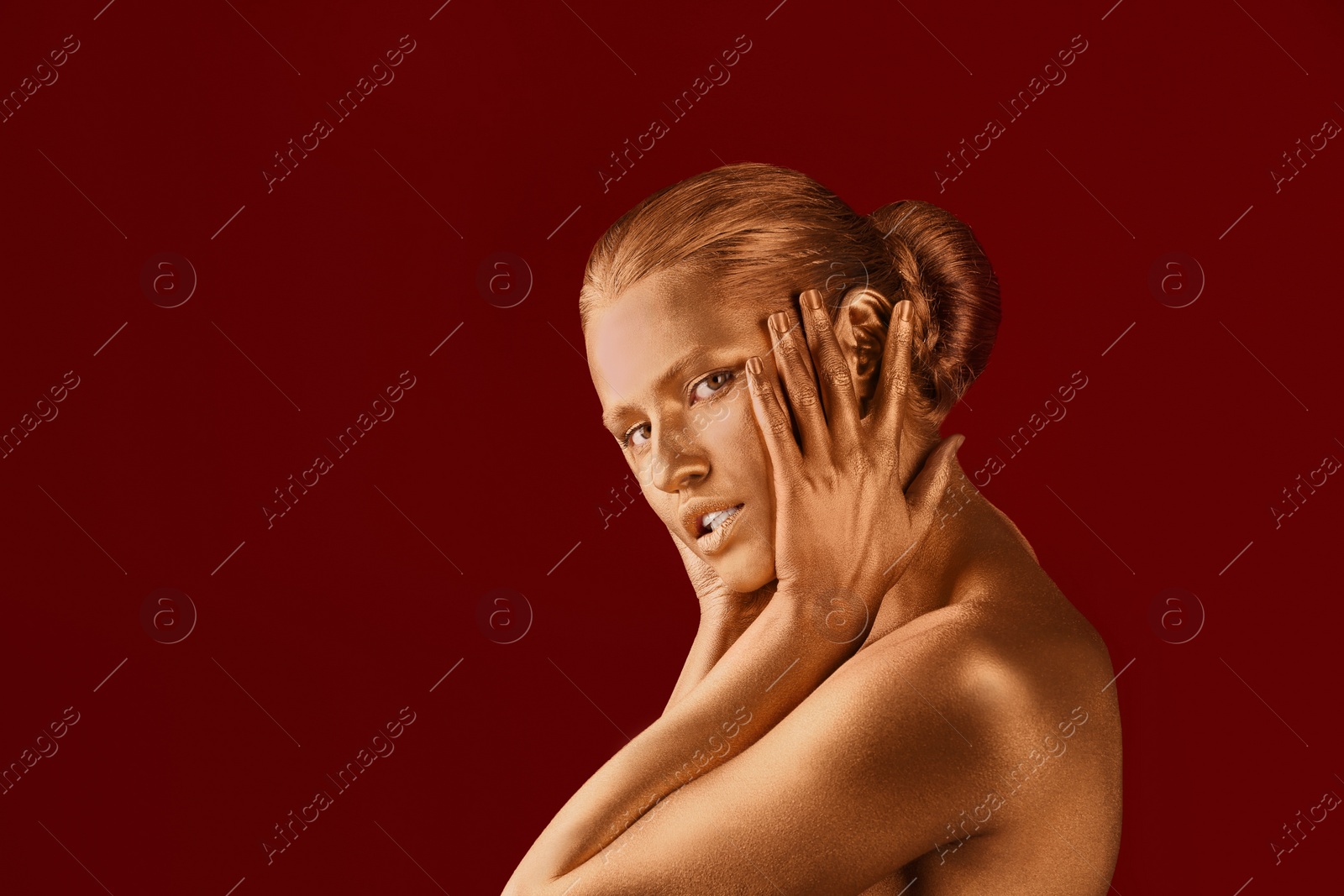 Photo of Portrait of beautiful lady with gold paint on skin against color background. Space for text
