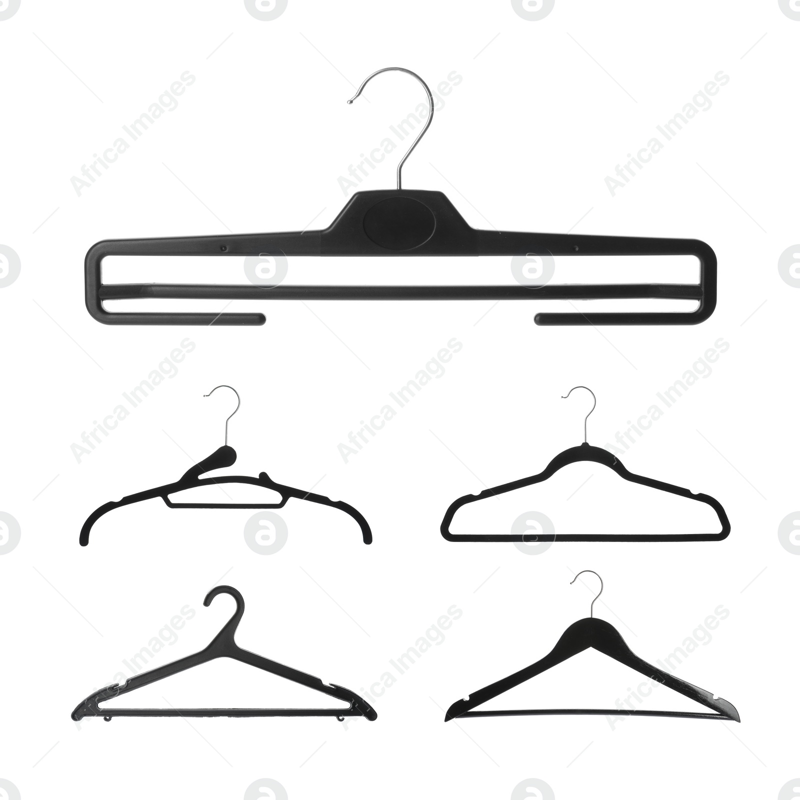 Image of Set with different empty hangers on white background