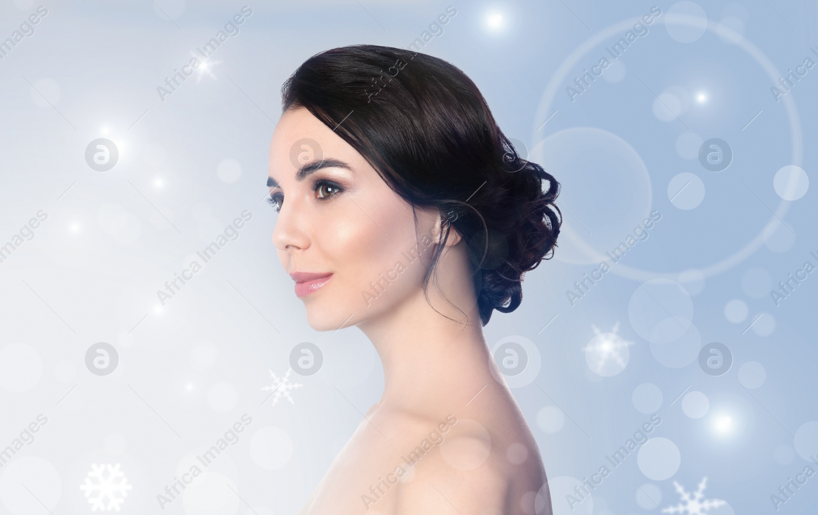 Image of Young woman with perfect smooth skin on light background, bokeh effect 