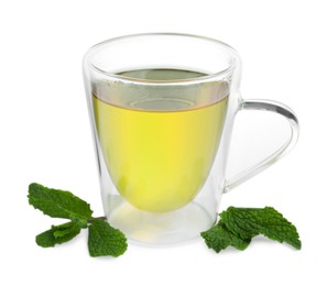 Fresh green tea in glass mug and mint isolated on white