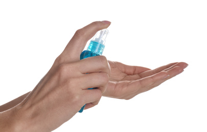 Woman applying antiseptic gel on white background, closeup