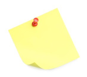 Photo of Blank yellow note pinned on white background, top view