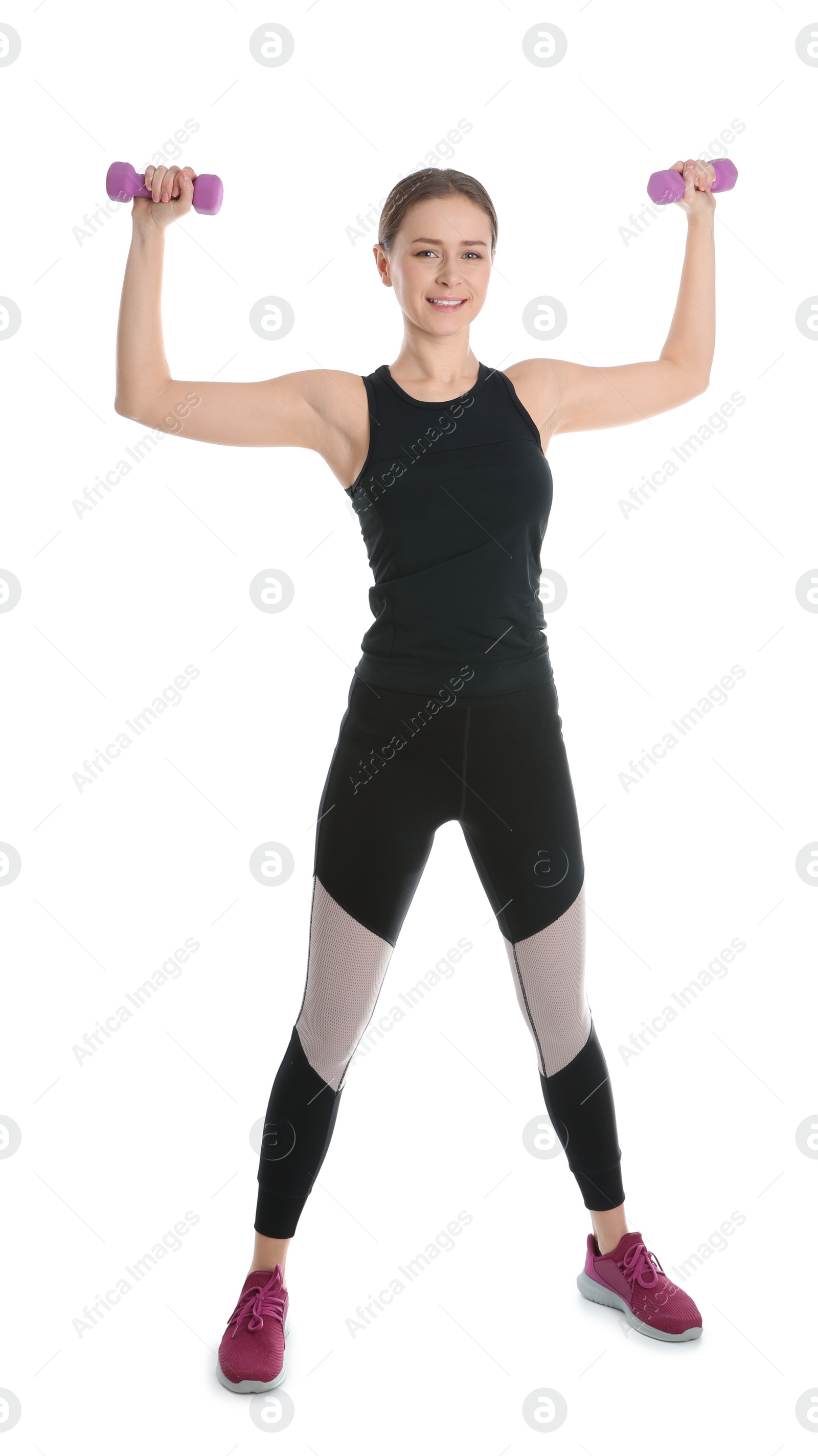 Photo of Young woman doing sports exercises isolated on white. Home fitness