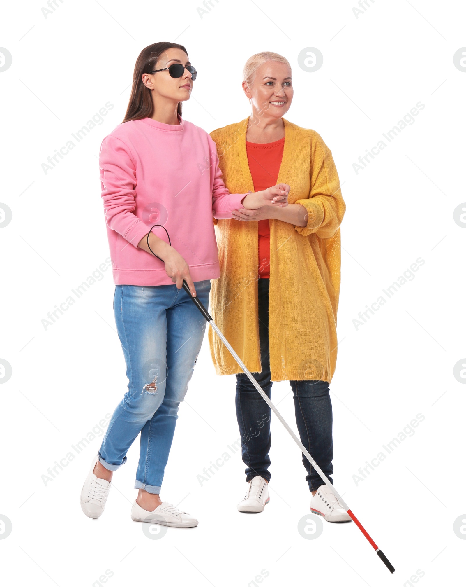 Photo of Mature woman helping blind person with long cane on white background