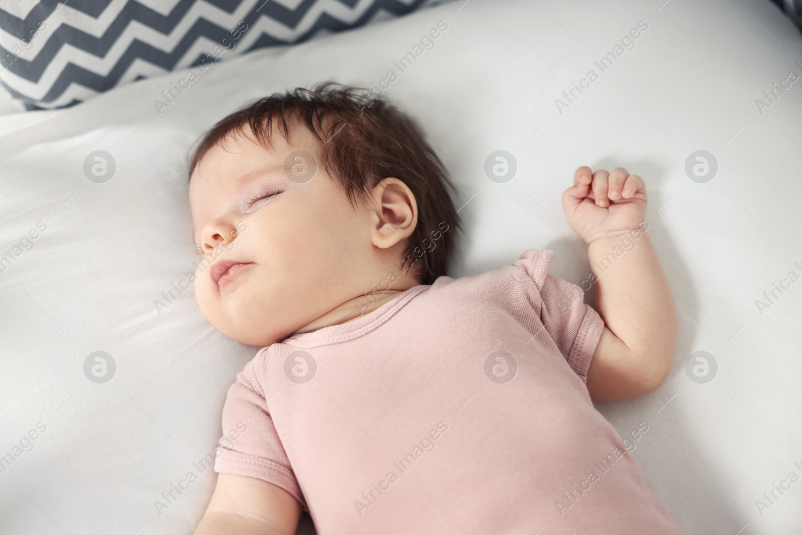 Photo of Cute little baby sleeping on cosy bed