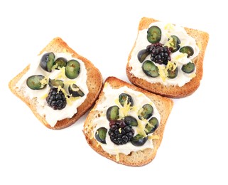Photo of Tasty sandwiches with cream cheese, blueberries, blackberries and lemon zest on white background, top view