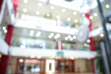 Blurred view of shopping mall entrance hall interior