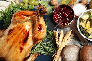 Photo of Composition with delicious turkey on grey background. Happy Thanksgiving day