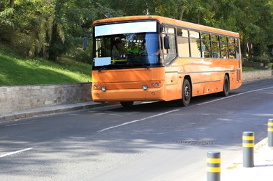 Photo of Bus on road in city. Public transport