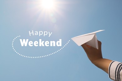 Image of Happy Weekend. Woman holding paper plane against blue sky, closeup