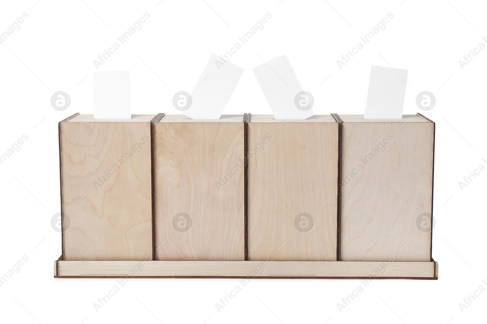 Photo of Wooden ballot boxes with votes isolated on white