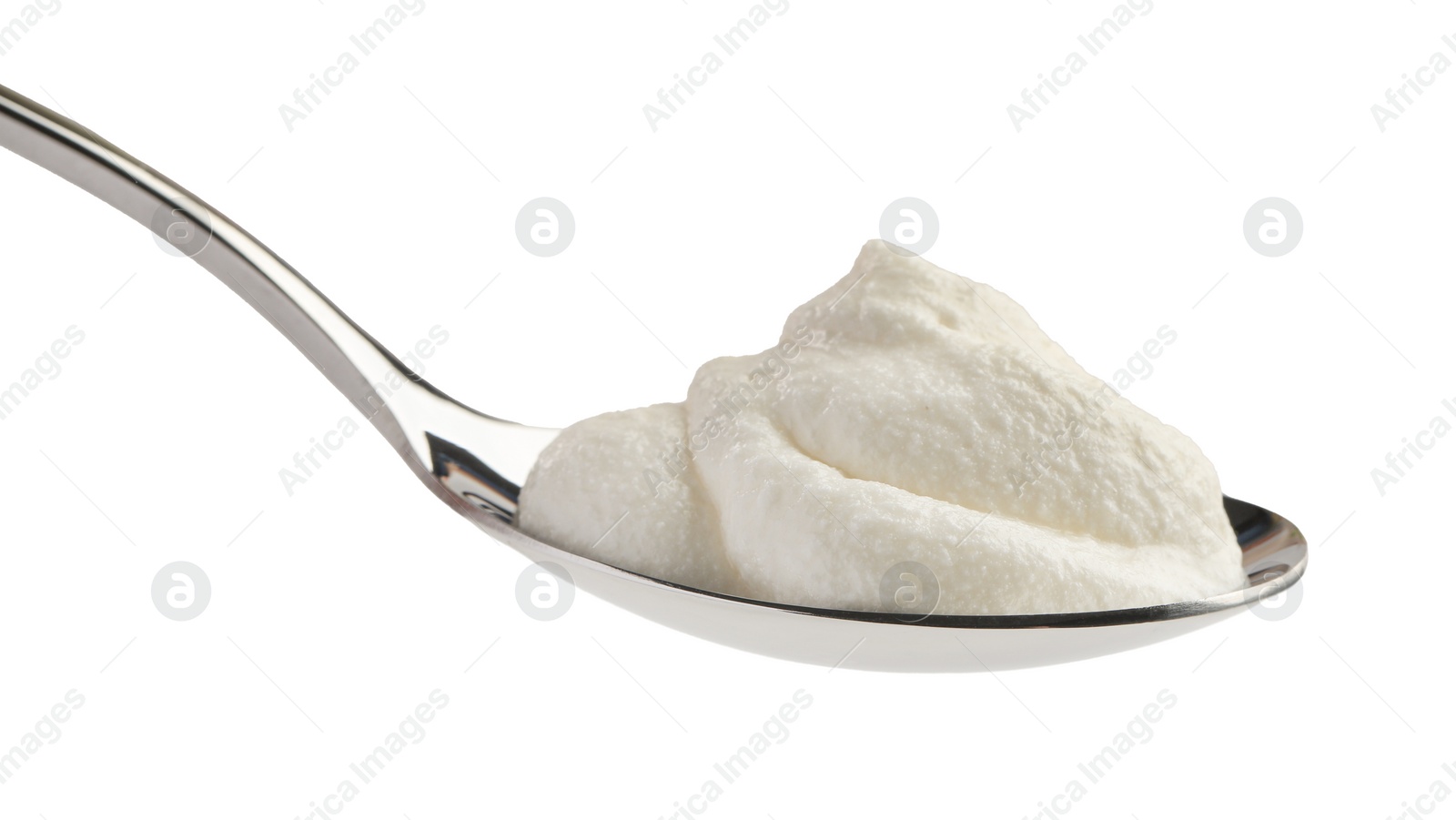 Photo of Silver spoon with sour cream isolated on white