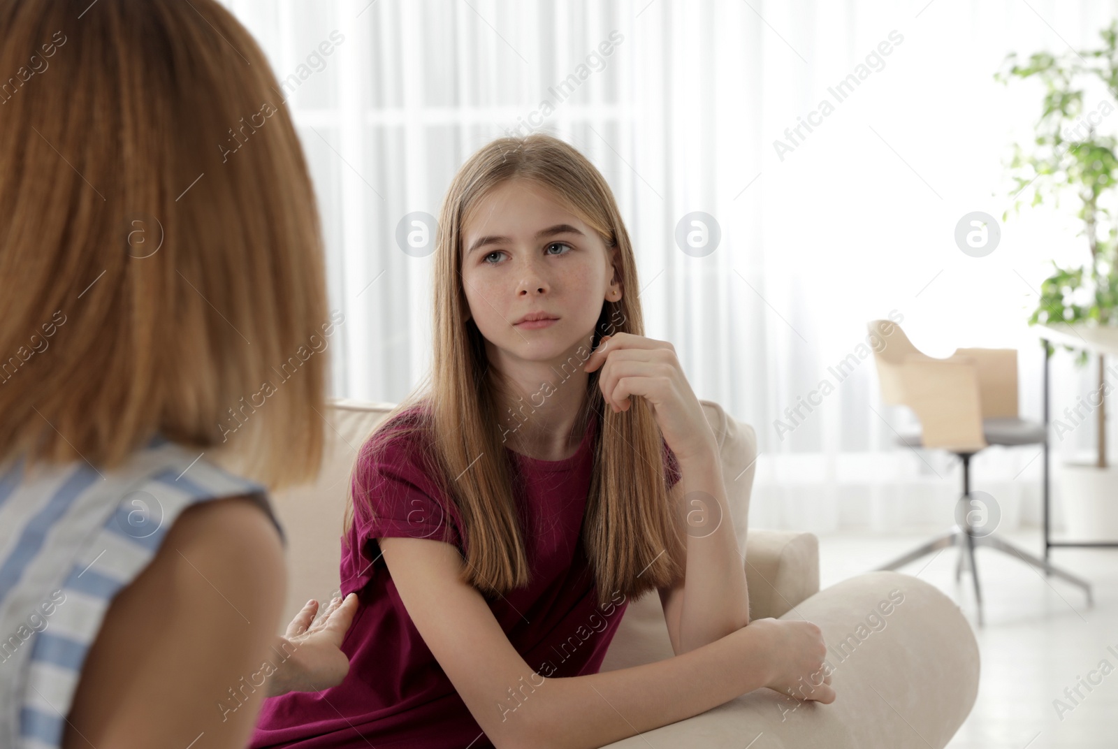 Photo of Mother scolding her teenager daughter at home