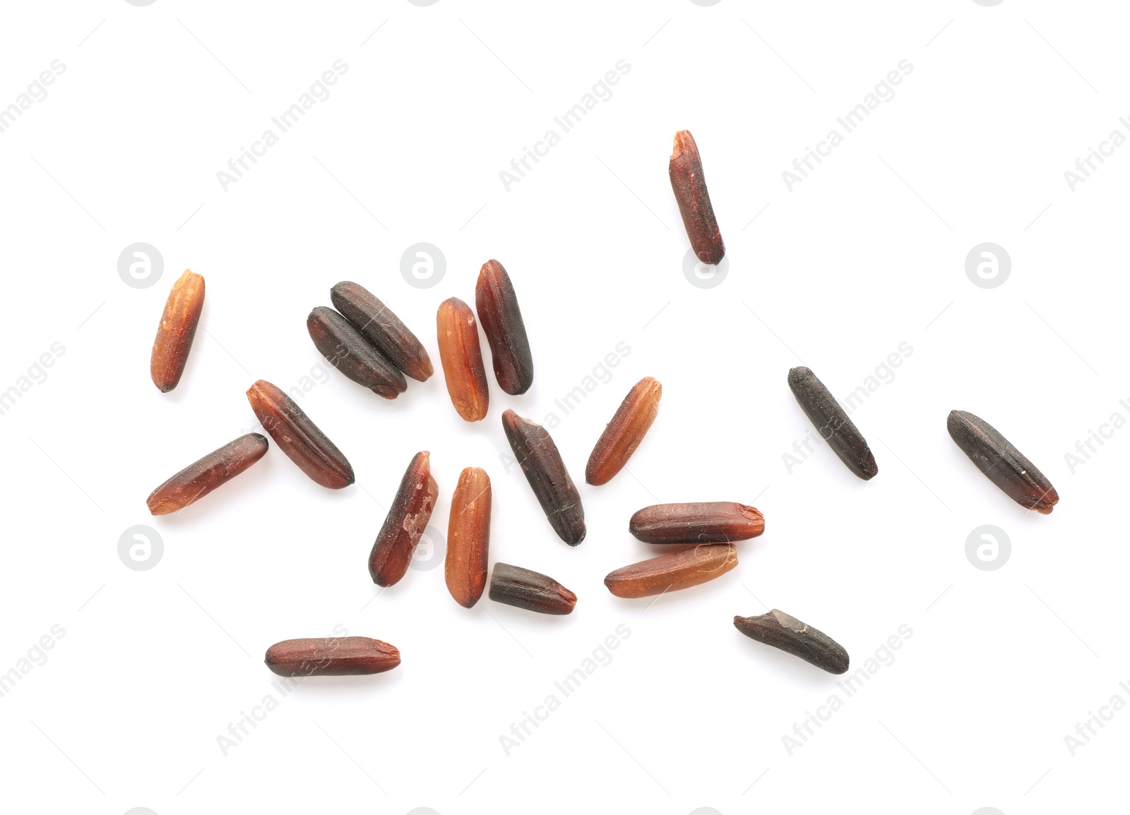 Photo of Scattered grains of brown rice on white background, top view