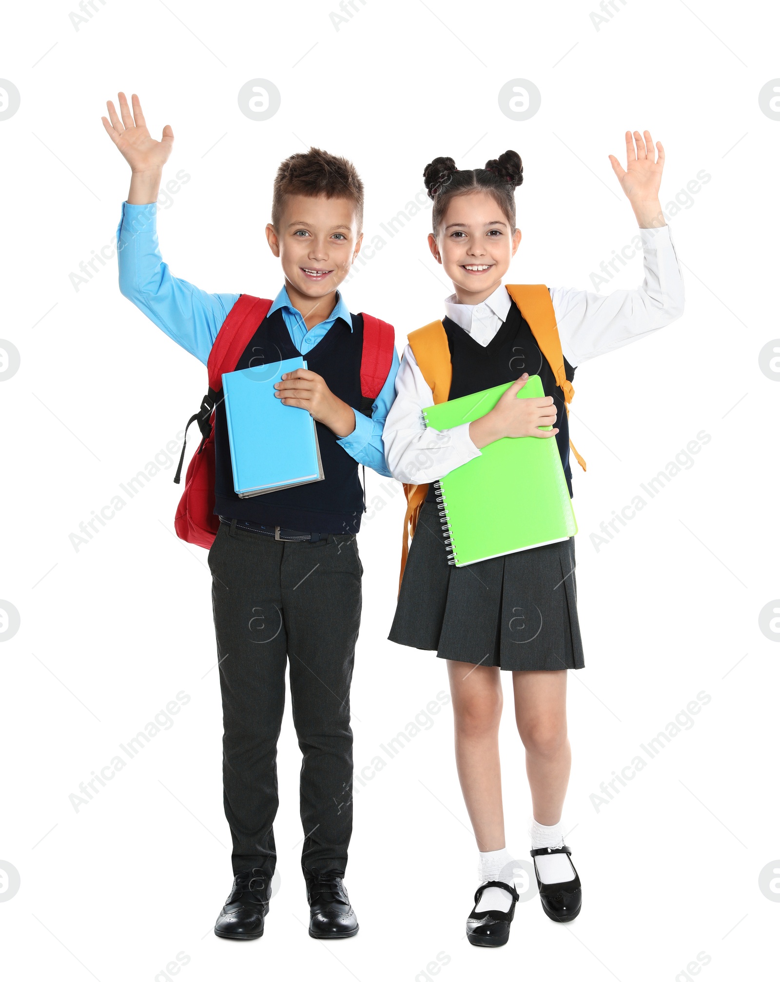 Photo of Happy children in school uniform on white background