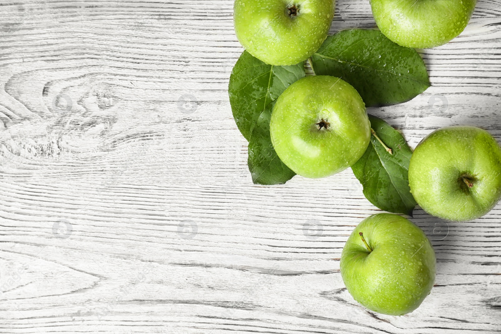 Photo of Fresh green apples on wooden background, top view