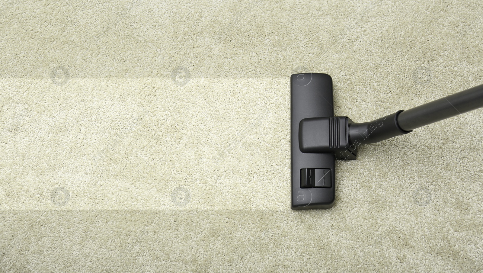 Image of Vacuuming carpet. Clean area after using device, top view