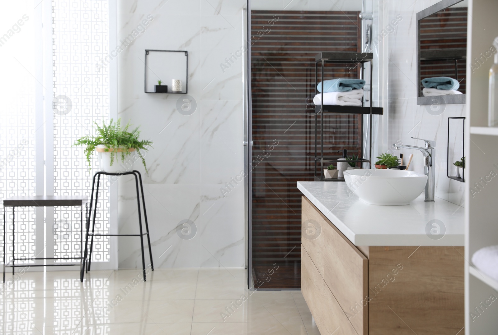 Photo of Bathroom interior with shower stall, houseplant and counter. Idea for design