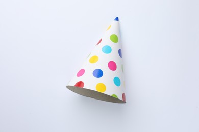 One beautiful party hat on light background, top view