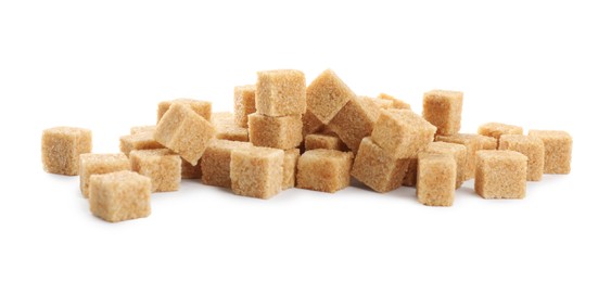 Photo of Pile of brown sugar cubes on white background